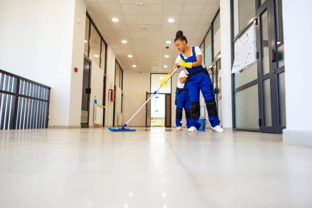 Janitors cleaning the floor in High school building